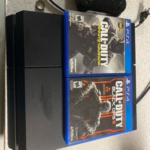 PS4 with controller and games